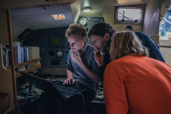Erik de Jong, Nick Carter, and Jaap Van Rijckevorsel setting up the iridium internet on Bagheera ©  Conor McDonnell